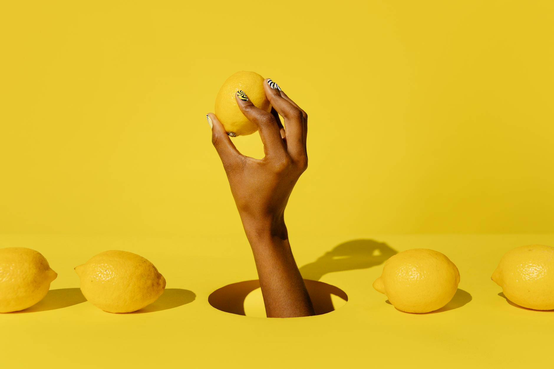 Hands holding pastel-colored silicone toys, symbolizing shared intimacy and pleasure